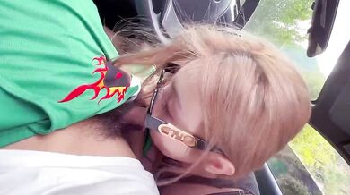 A beautiful girl gives a blowjob in the car