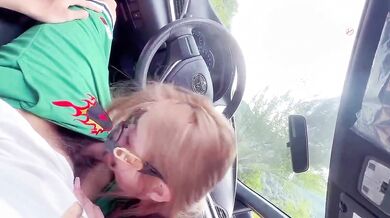 A beautiful girl gives a blowjob in the car