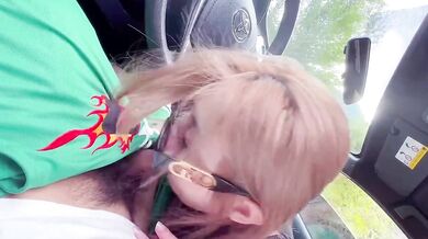 A beautiful girl gives a blowjob in the car