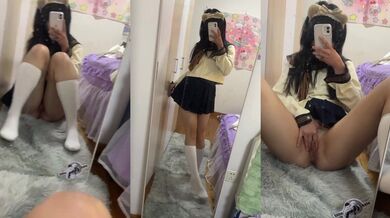 Schoolgirl in White Socks and Sailor Uniform Poses Seductively Before Mirror