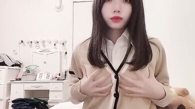 Cute Japanese Girl Caressing Her Breasts