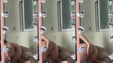 The girl masturbates in front of the mirror on the bed and screams