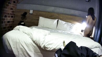 College student couple takes selfies on hotel date