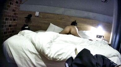 College student couple takes selfies on hotel date