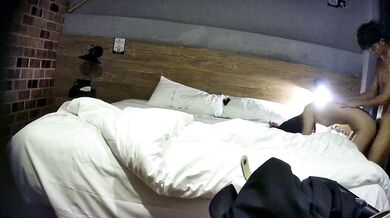 College student couple takes selfies on hotel date