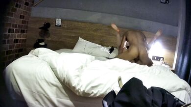 College student couple takes selfies on hotel date